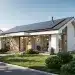 Modern eco-friendly home with solar panels and green landscaping